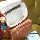 Florence faux leather nappy backpack in tan fits your lap top so it's perfect to double as a work bag.