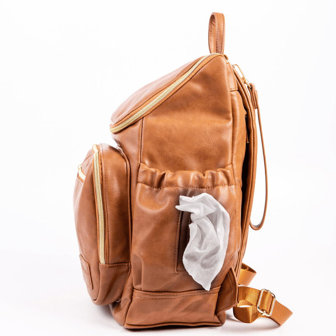 Florence nappy bag backpack tan vegan leather - side view featuring baby wipe dispenser product.