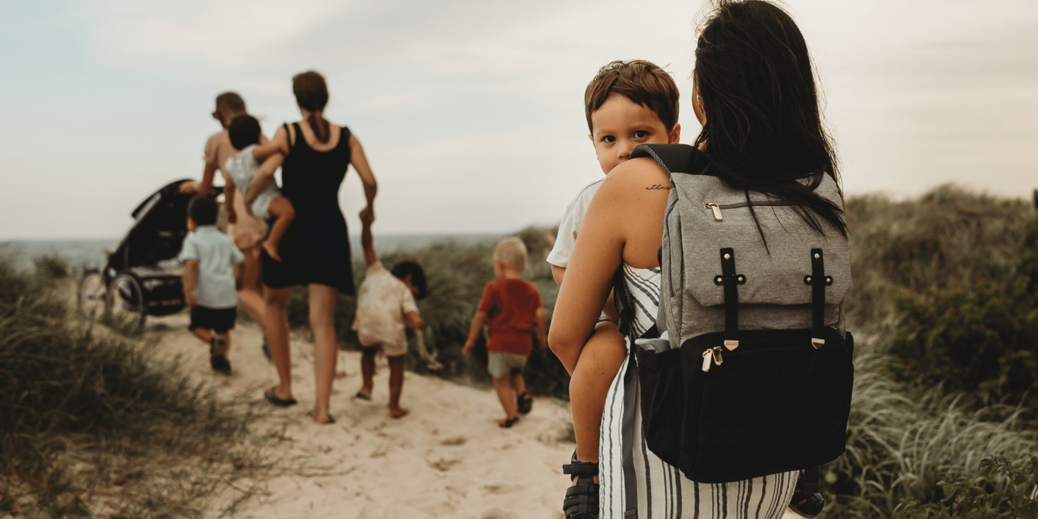 Shop Australia's best nappy bags - Two Mums at the beach in Melbourne wearing nappy backpack by Bambino Bagz 
