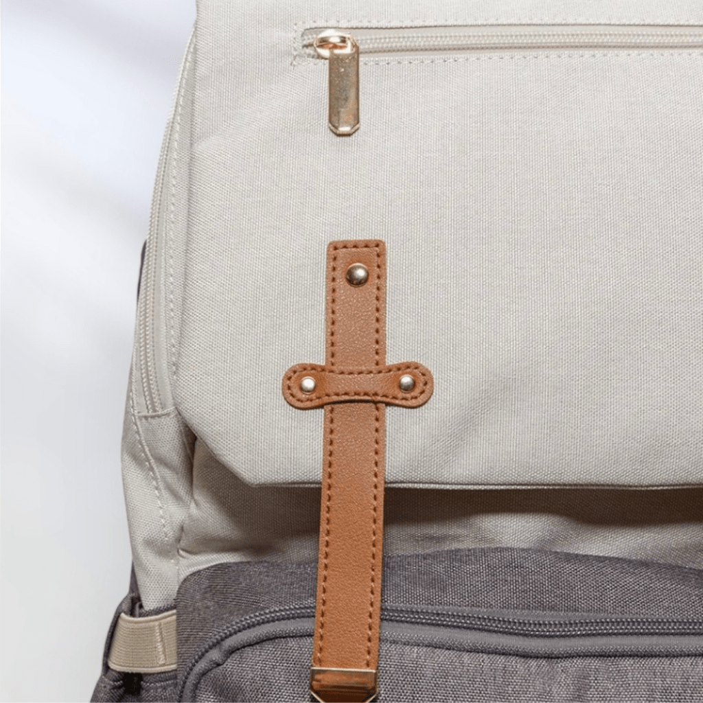 nappy bag with tan detail and insulated pockets waterproof fabric