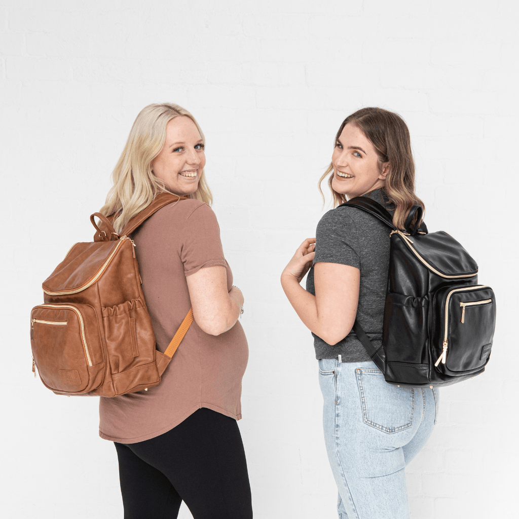 Florence vegan leather nappy bag backpack available in both tan and black vegan leather with gold hardware and padded straps