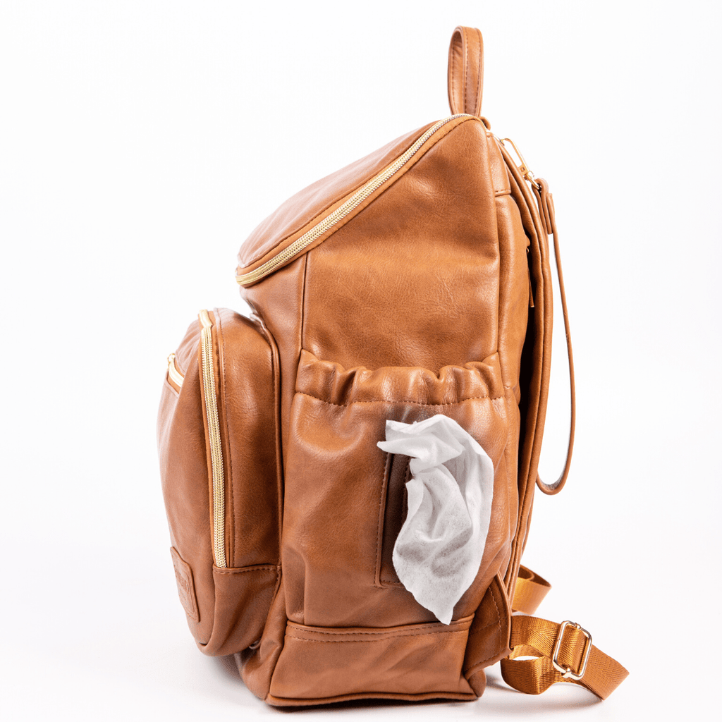 Florence nappy bag backpack tan vegan leather - side view featuring baby wipe dispenser product. 