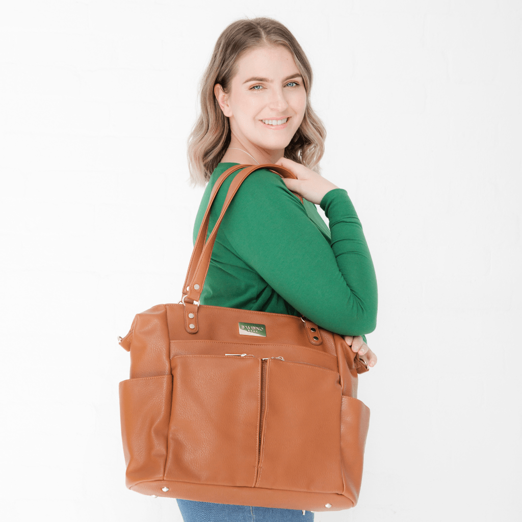 Sofia four way  nappy bag - tan leather worn over the shoulder. The perfect versatile baby bag nappy bag diaper bag 